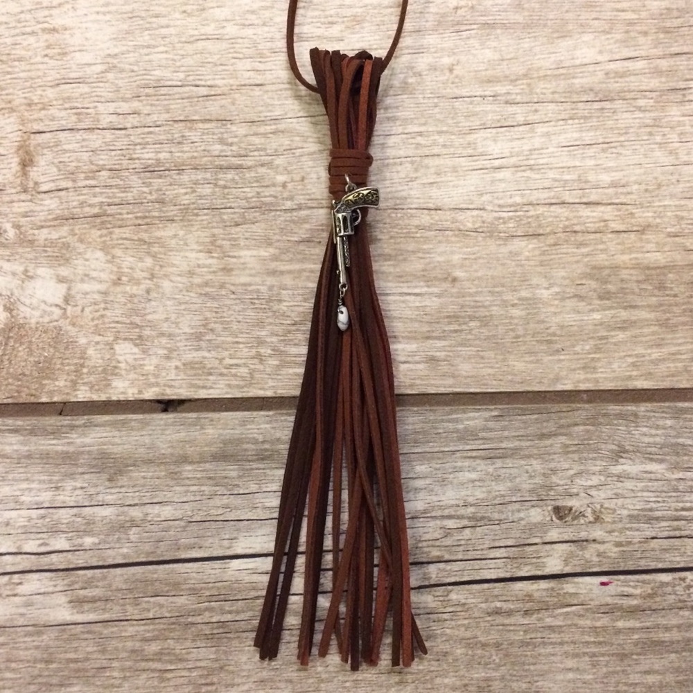 Pistol with tear drop pendant suede tassel